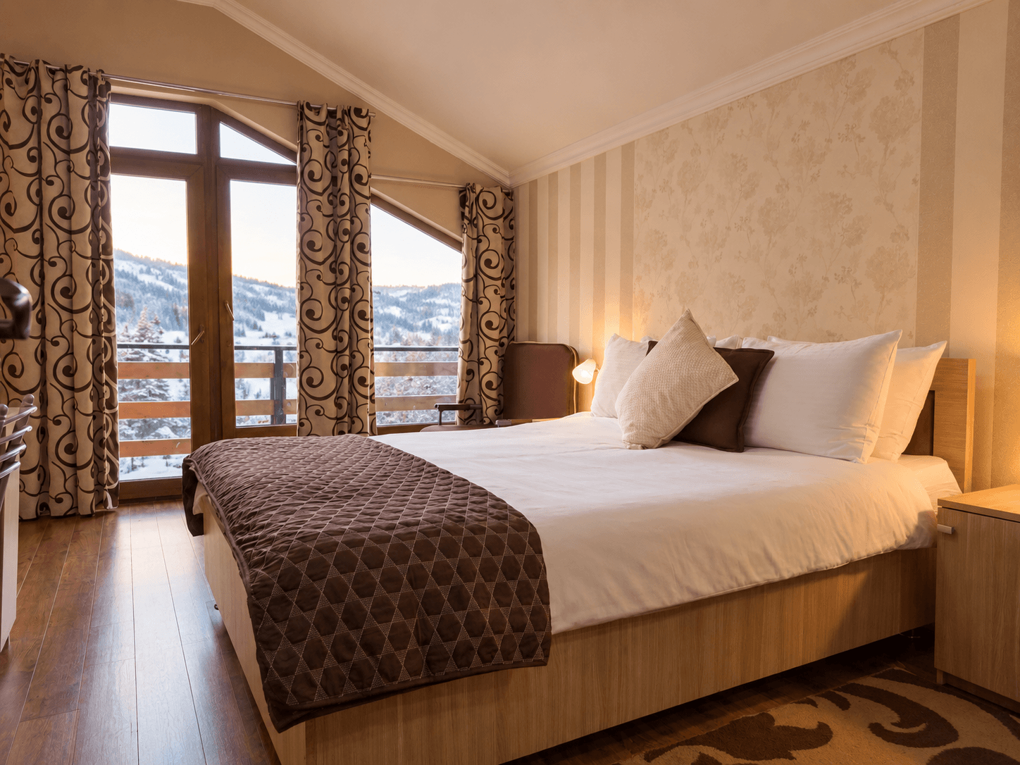 Villa Mtashi bedroom with a snowy mountain view
