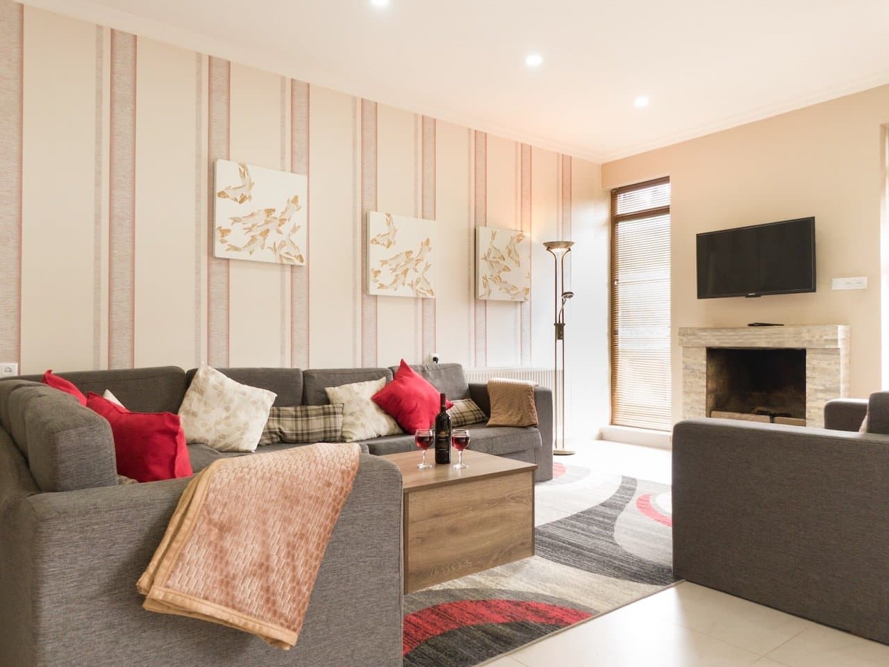 Open-plan villa lounge with sofas and natural light.