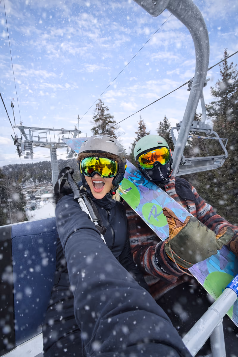 Amike Oosthuizen riding a ski lift in Georgia