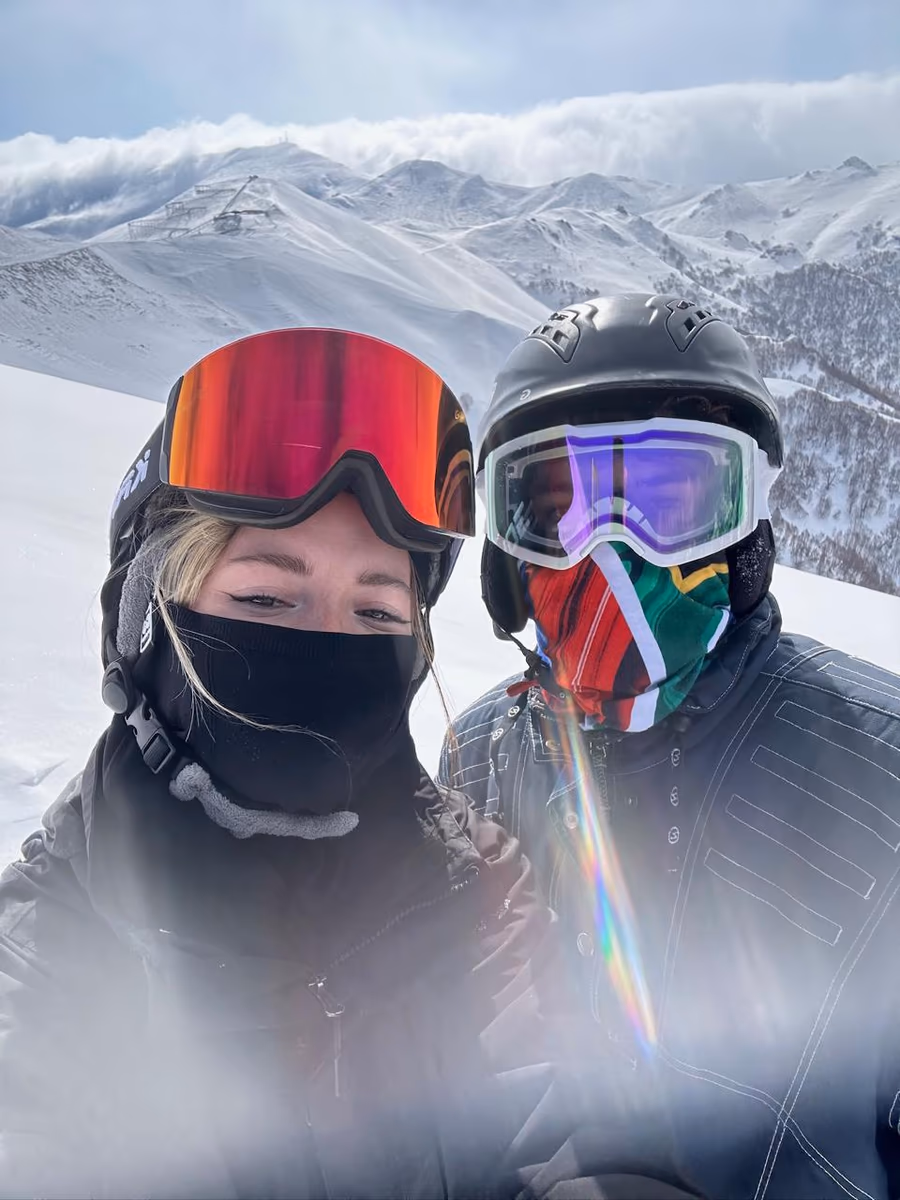 Anja Oerlemans skiing with a companion in the snowy mountains of Georgia