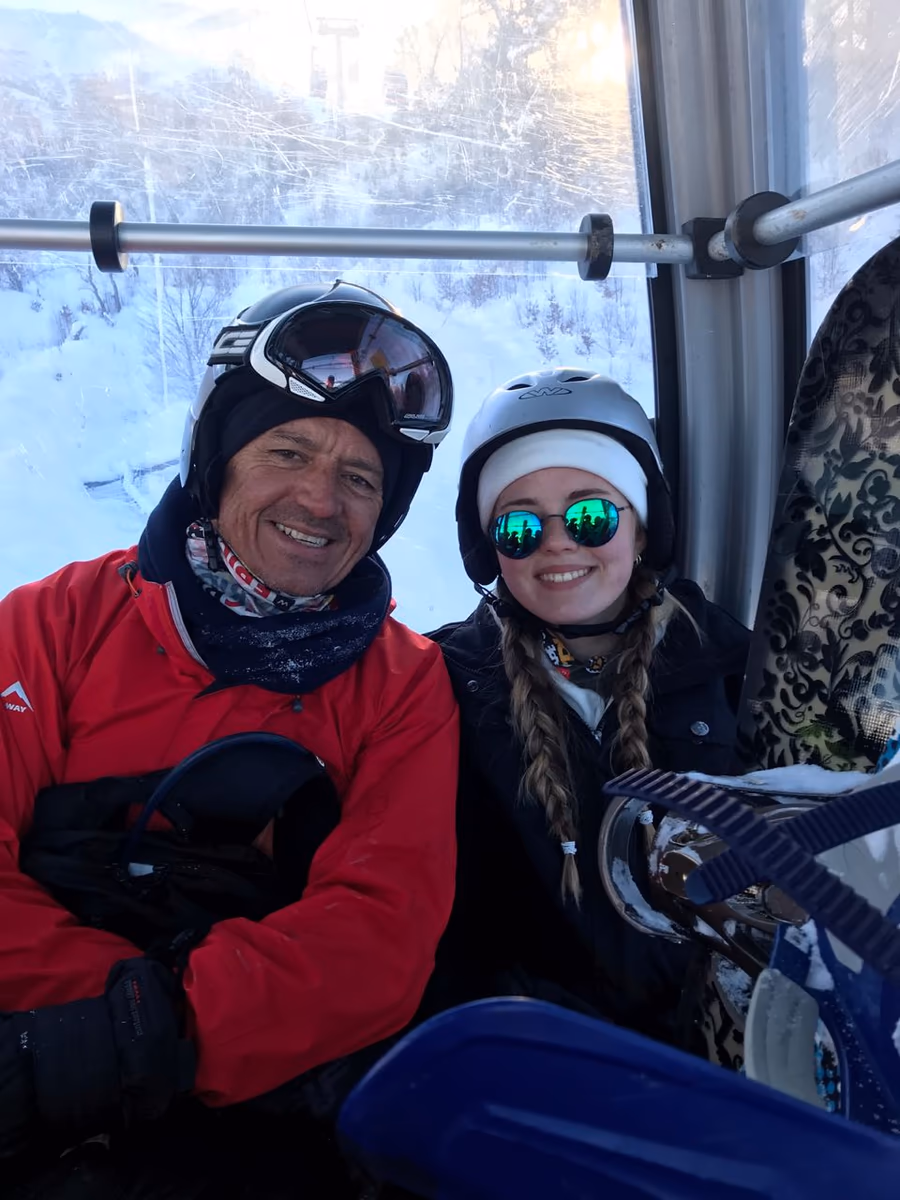 Anja Oerlemans riding a ski lift in Georgia