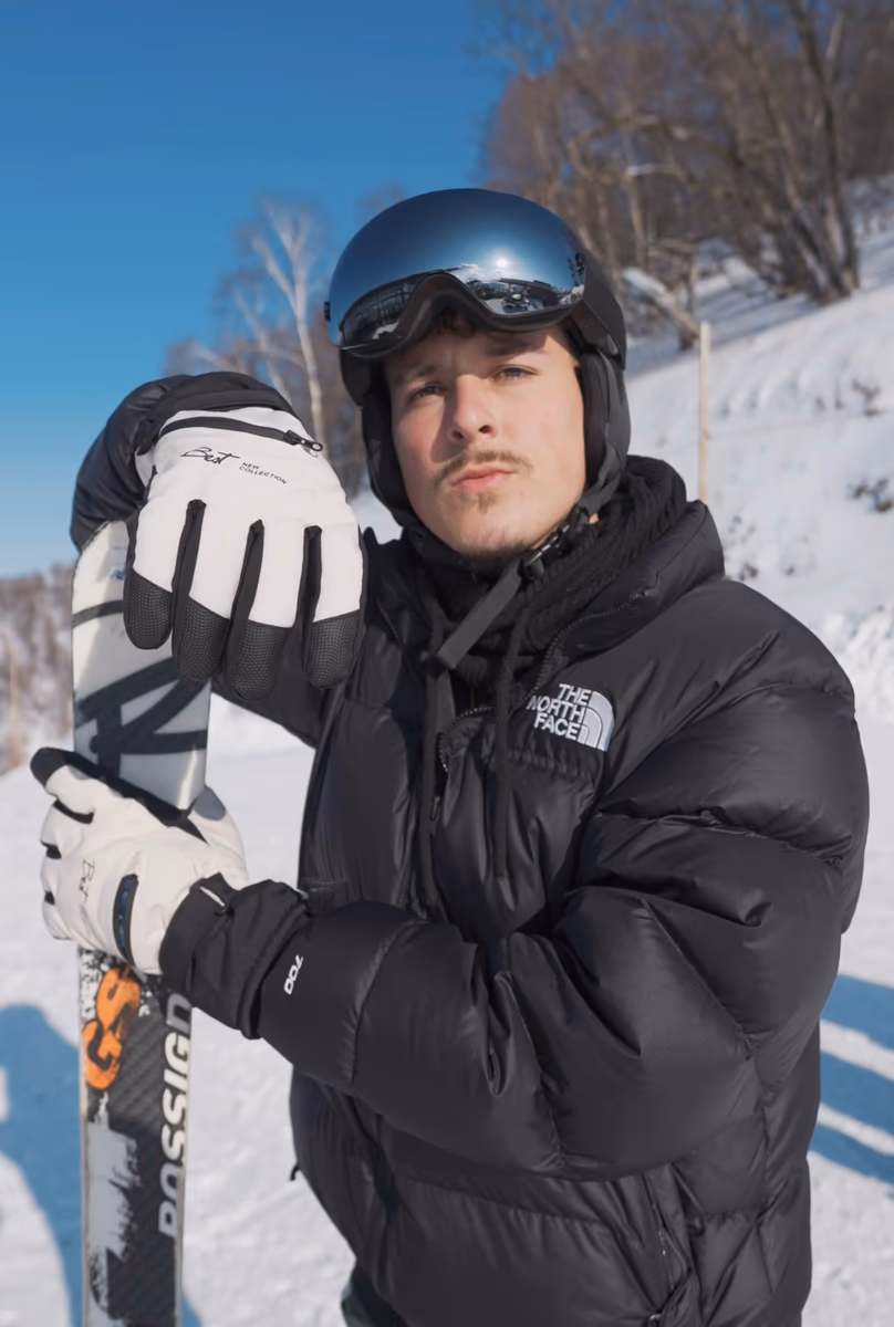 Justin Denobrega in ski boots in the snow
