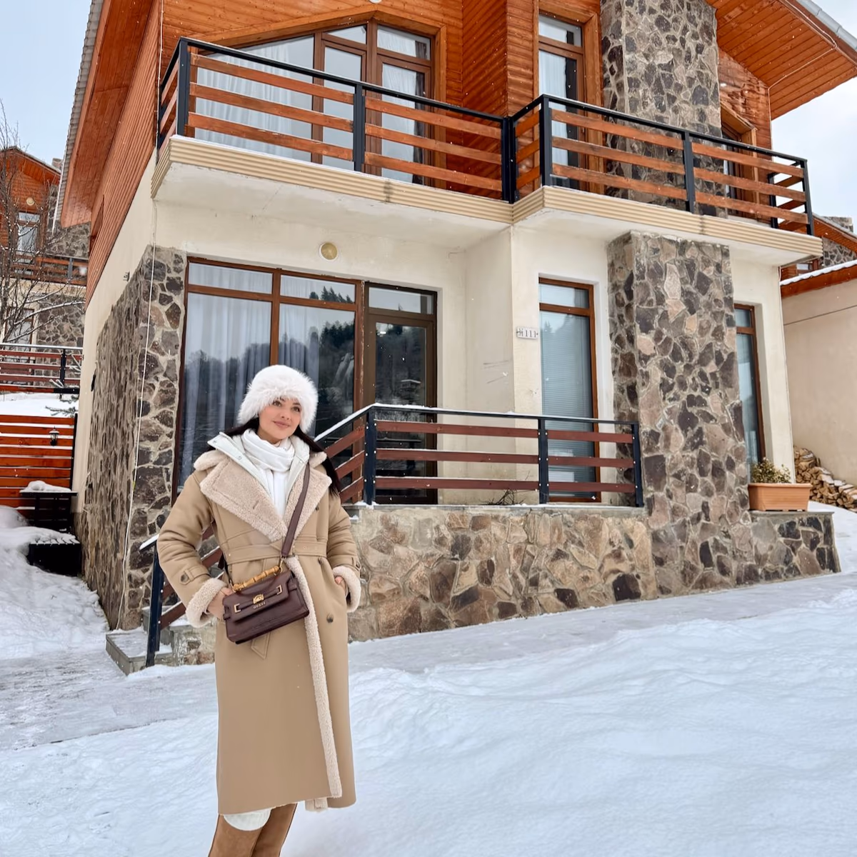 Natasha Joubert standing in the snow outside Villa Mtashi in Bakuriani