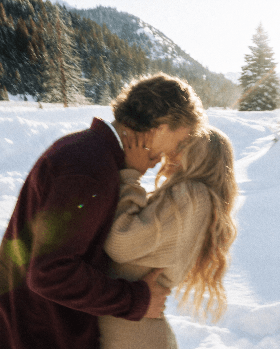 Couple sharing a close moment in the snow