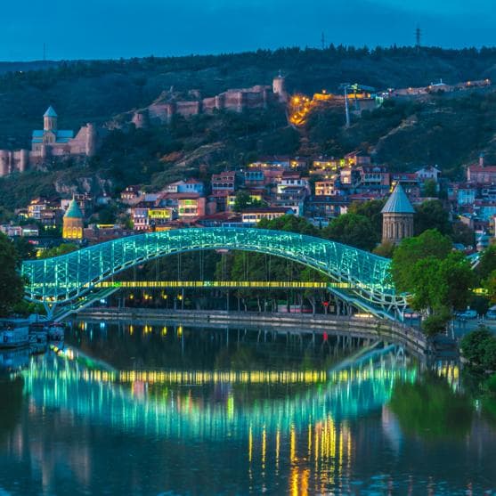 Bridge of Peace illuminated over the Mtkvari River in Tbilisi